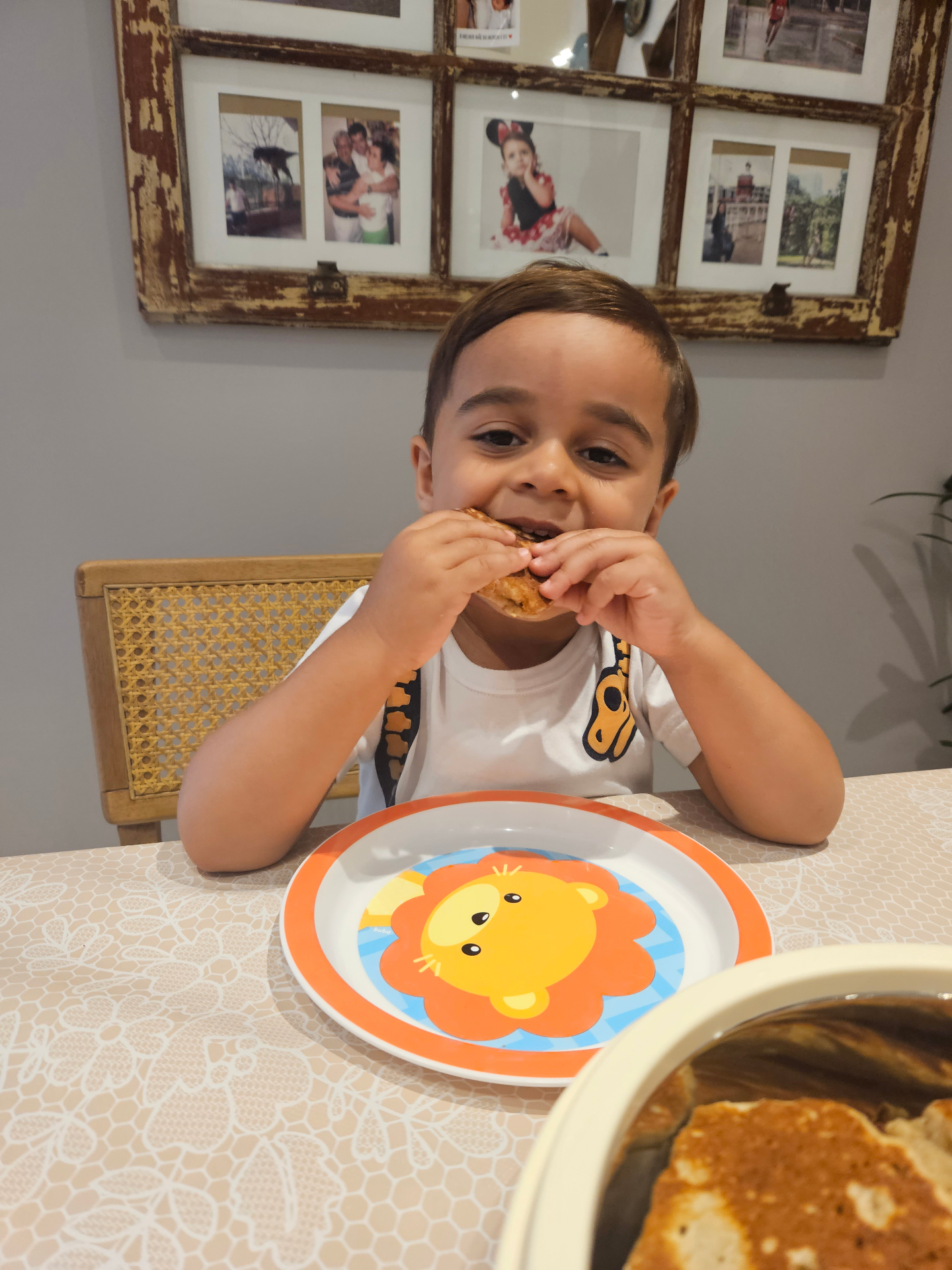 Happy toddler eating solids